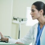 Doctor and Patient Looking at Computer